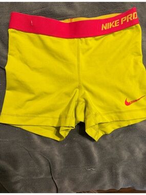 Nike Women’s Neon Yellow Athletic Shorts with Pink Swoosh